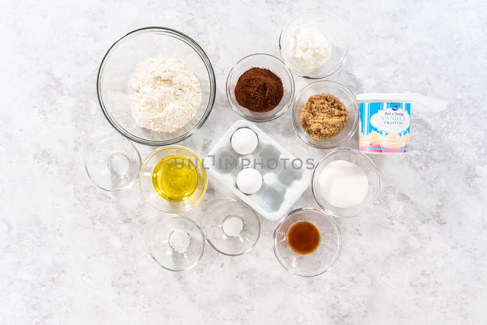 Denver, Colorado, USA-January 29, 2021 - Flat lay. Ingredients to prepare unicorn rainbow chocolate cupcakes on the counter.