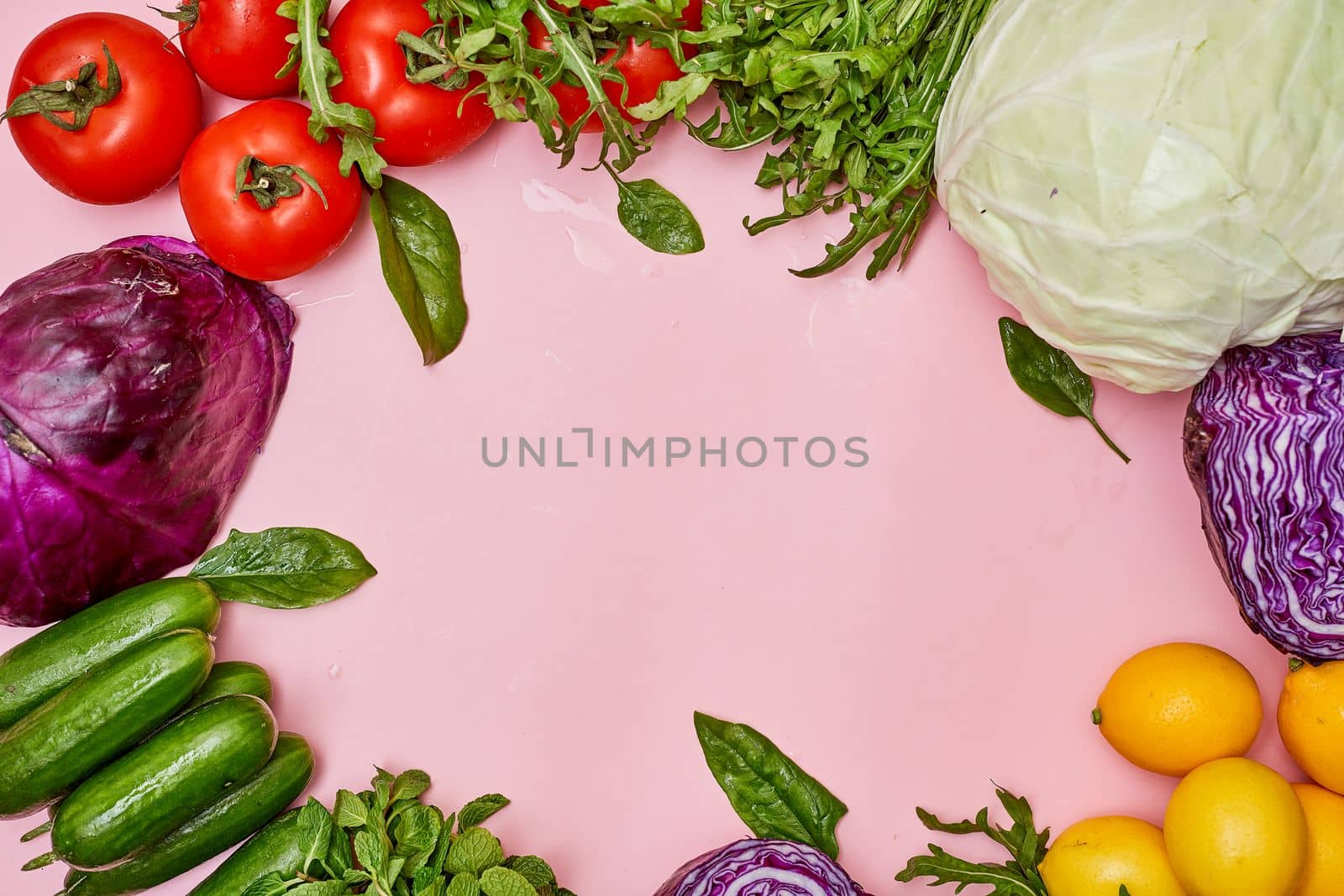 vegetables and fruits on a pink background with copy - space in the top right hand corner to the middle left