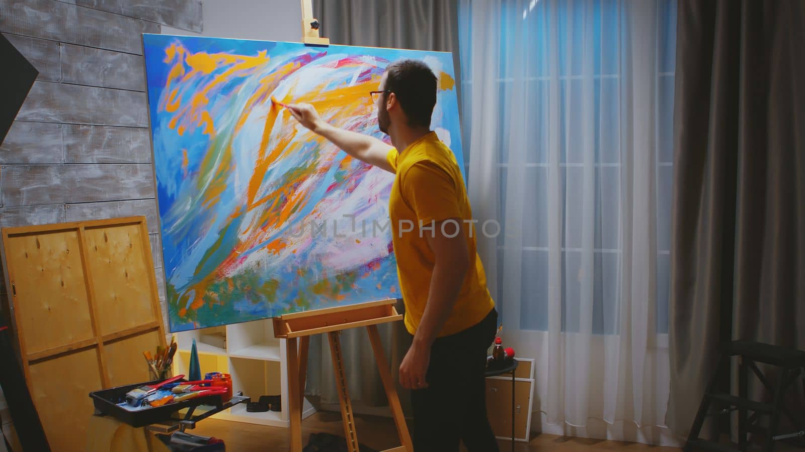 Inspired man while painting by DCStudio