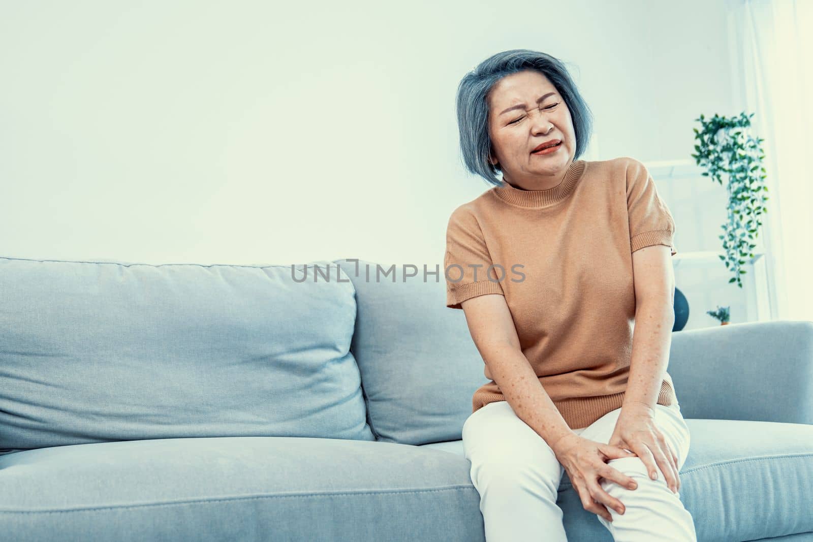An agonizing elderly woman is experiencing chest pain. by biancoblue