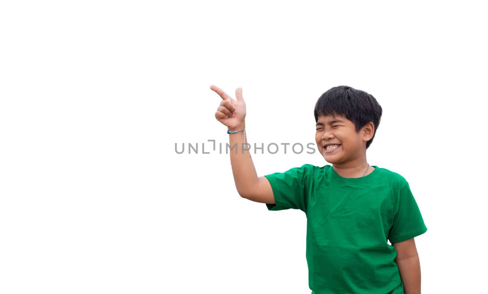 The boy smiled and pointed his hand to his side. on a white background