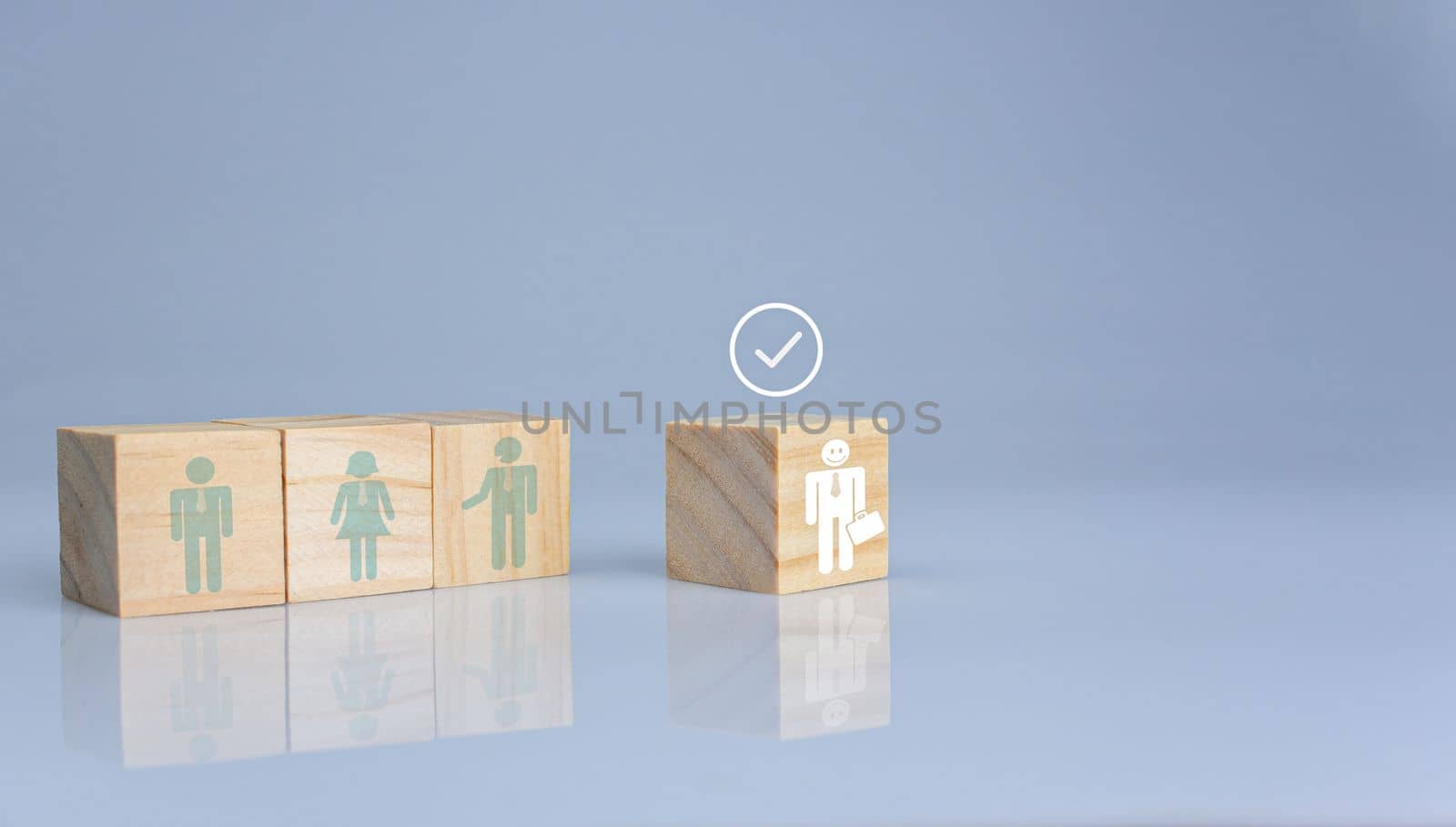 Concept of Business and HR for leadership and team leader. One cube wood block out in front  Different and stand out from the group