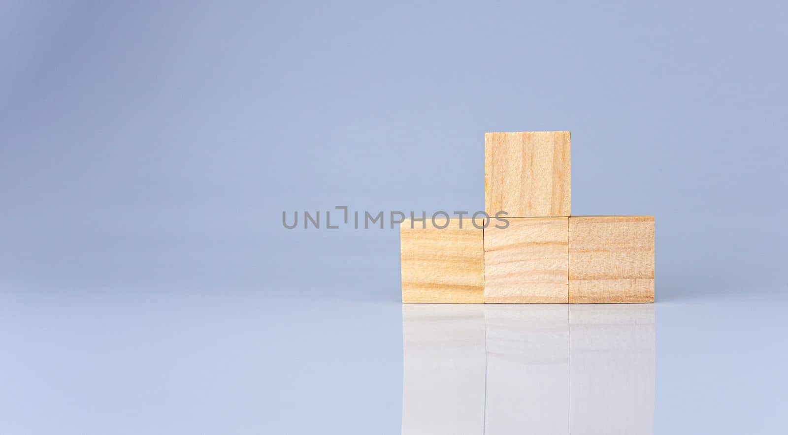 empty wooden blocks lined up on a white background. Business concept.