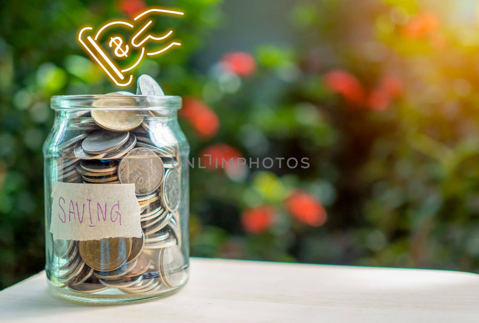 Coins in glass bottles on nature background. The concept of savings and investment.