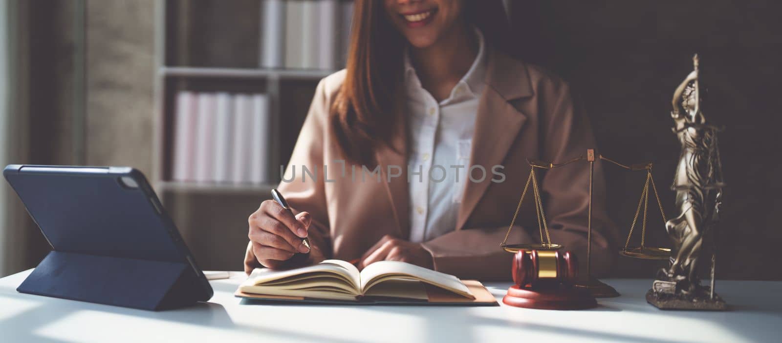 Lawyer working at office. Asian Lawyer doing with contract or document in office. Law, legal services, advice, Justice and real estate concept.