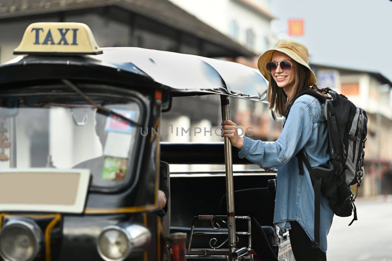 Smiling caucasian female tourist with backpack on holiday vacation trip in Thailand. Travel Lifestyle vacations concept.