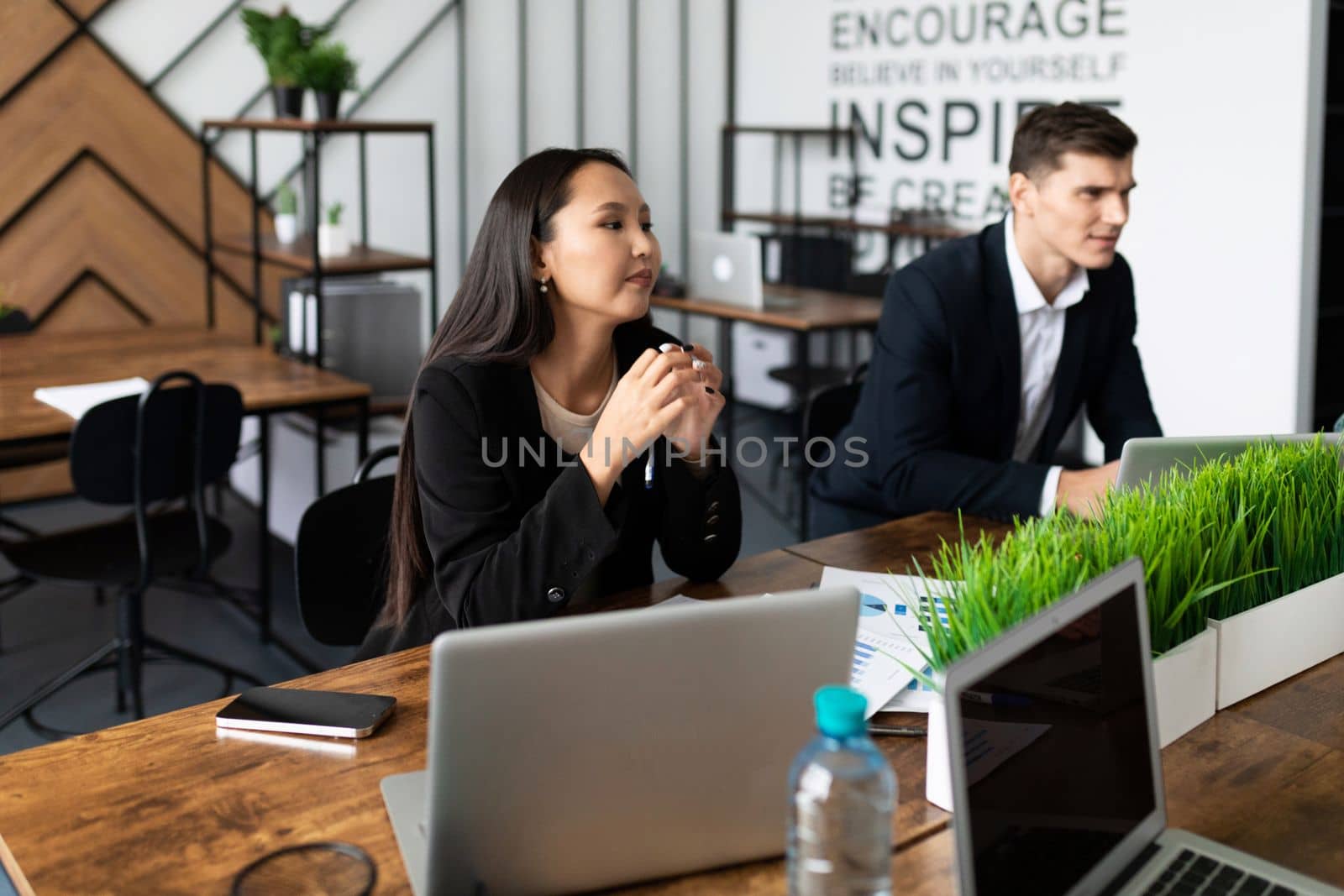 business negotiations at a large table in the office.