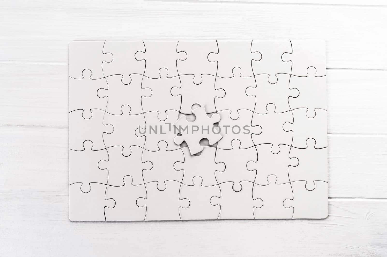 Top view of white jigsaw puzzle