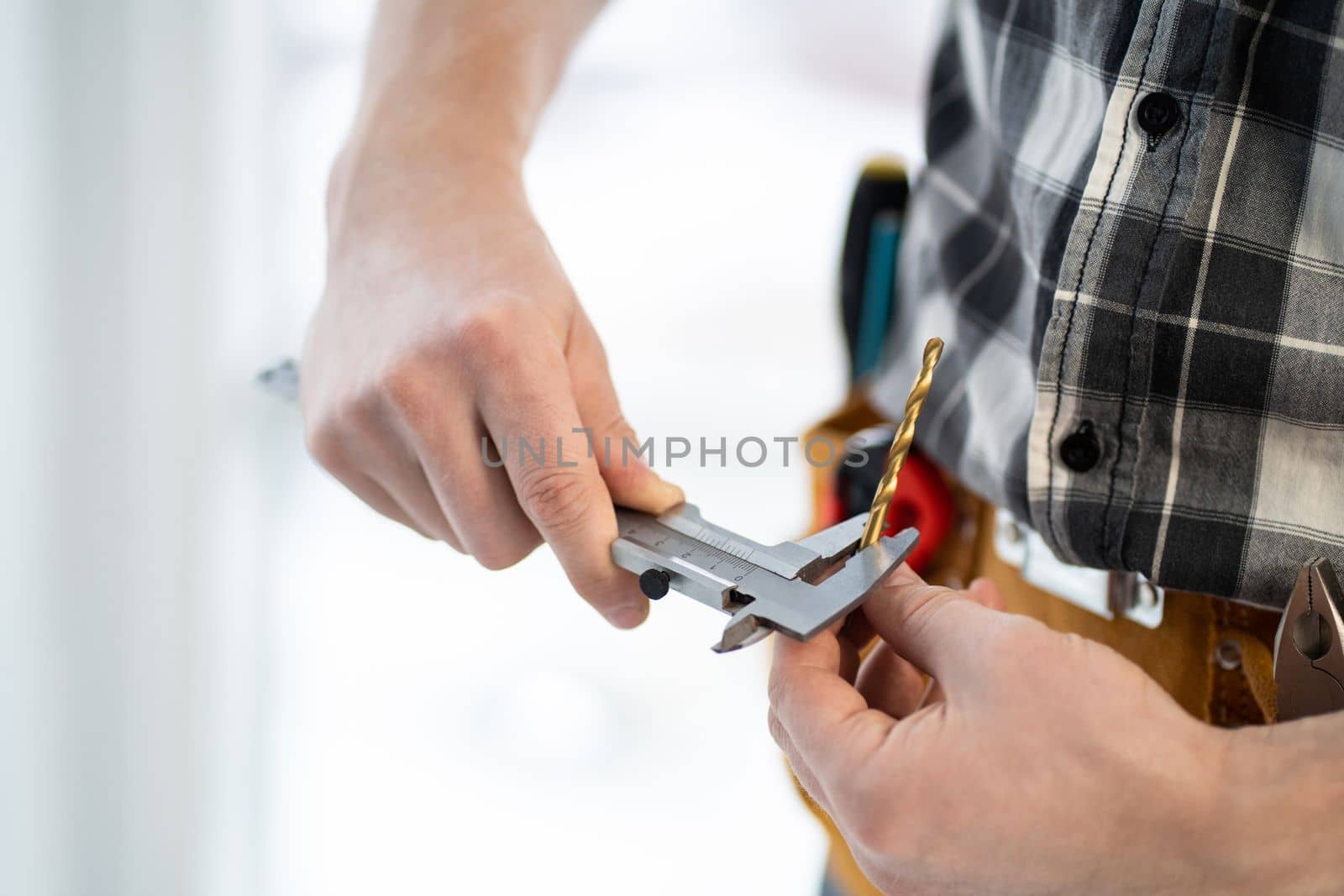 Master measuring drill diameter using calipers in light workshop