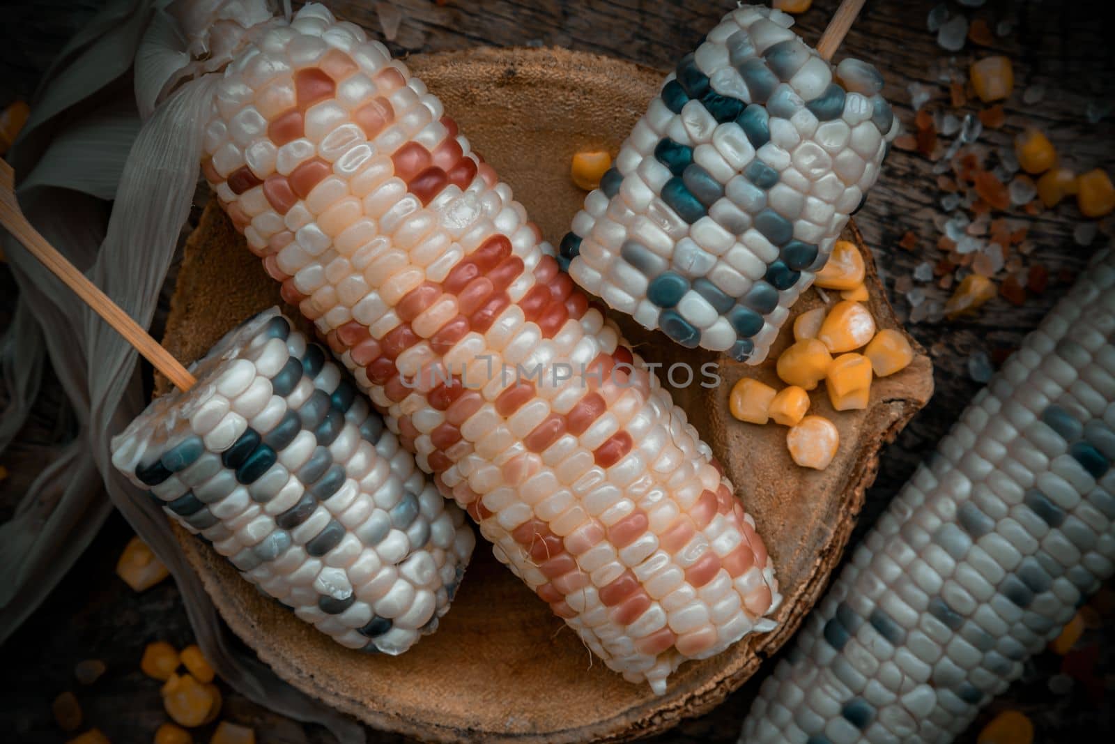 Close-up of Fresh waxy corn or Sweet glutinous corn and Corn kernelson Rustic old wooden background. Tropical whole grain food, Top view, Selective focus.