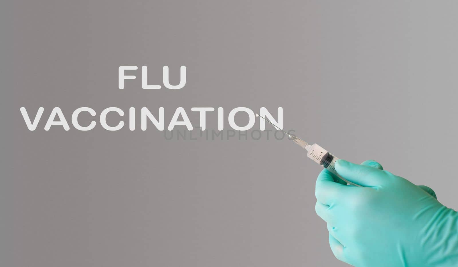 flu vaccination text on gray background. Flu protection concept by Alla_Morozova93