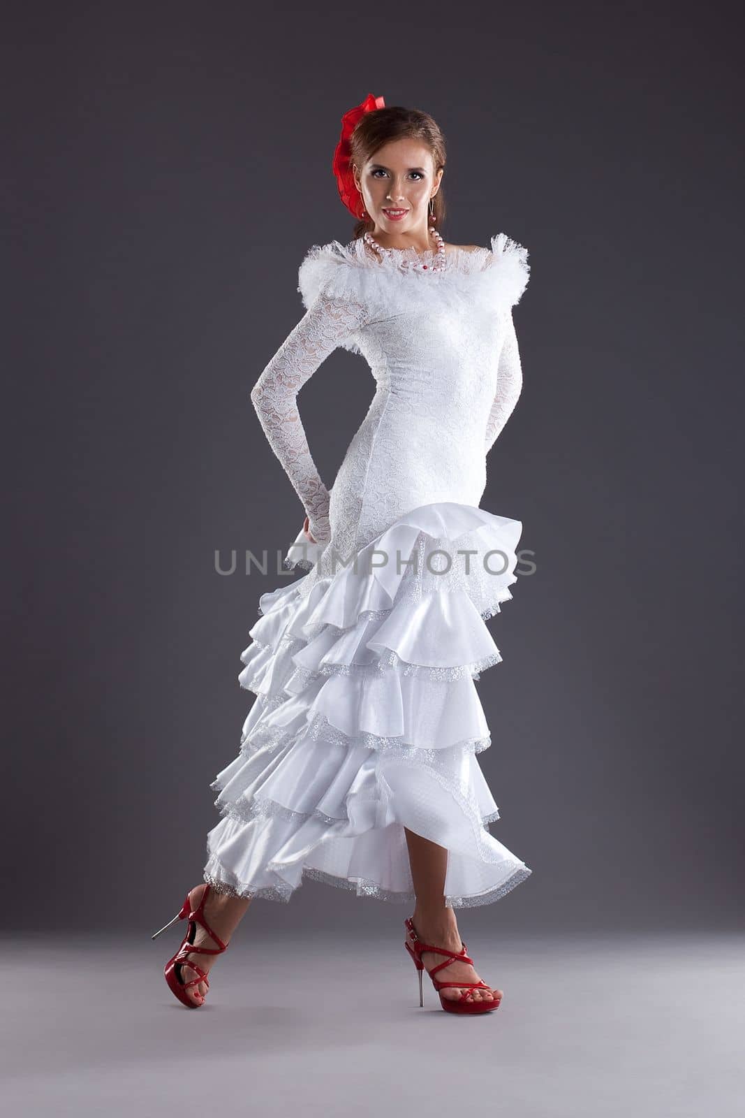 Young woman dance in white oriental flamenco costume