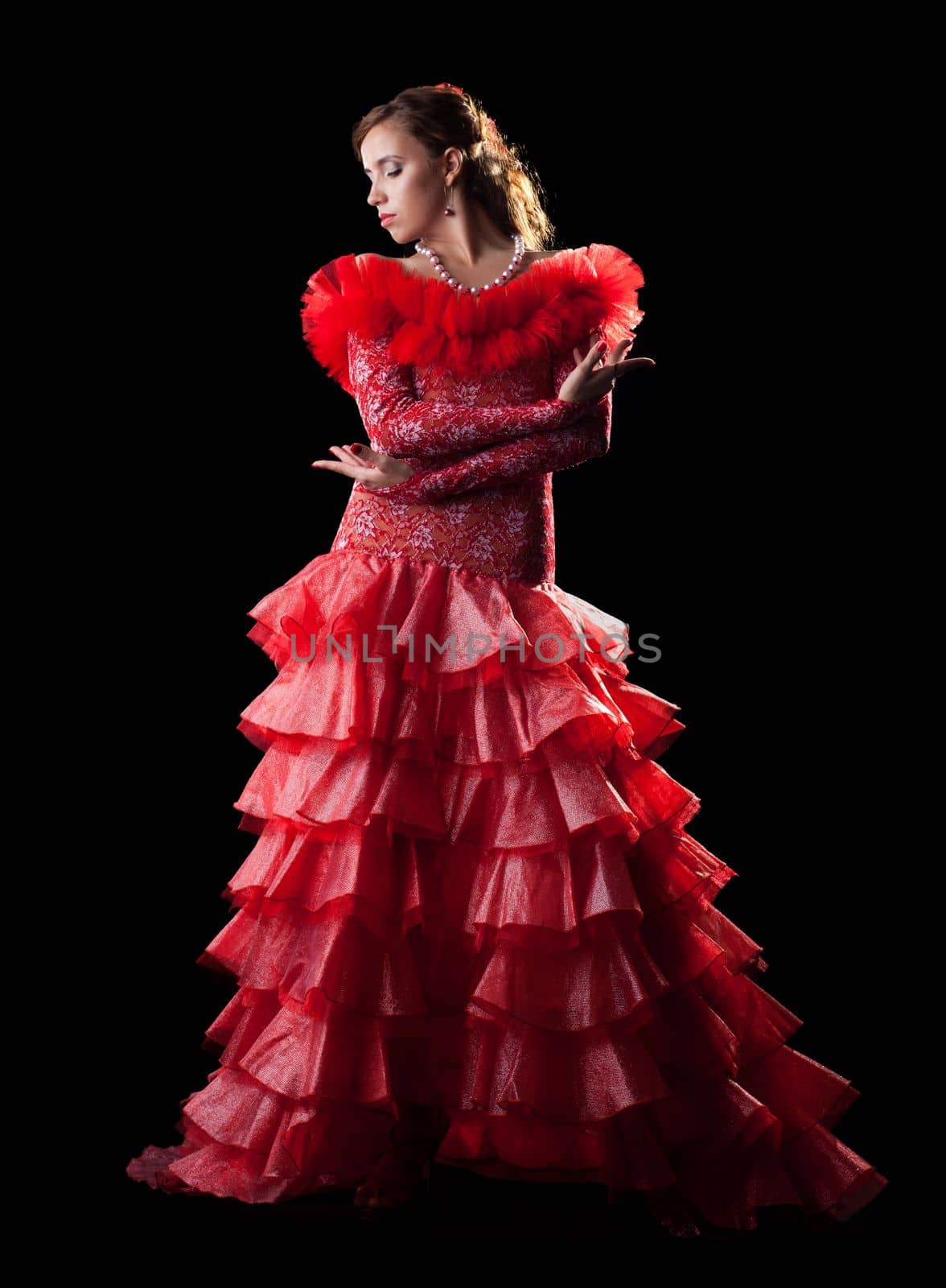 Pretty young woman like flamenco dancer in red oriental costume