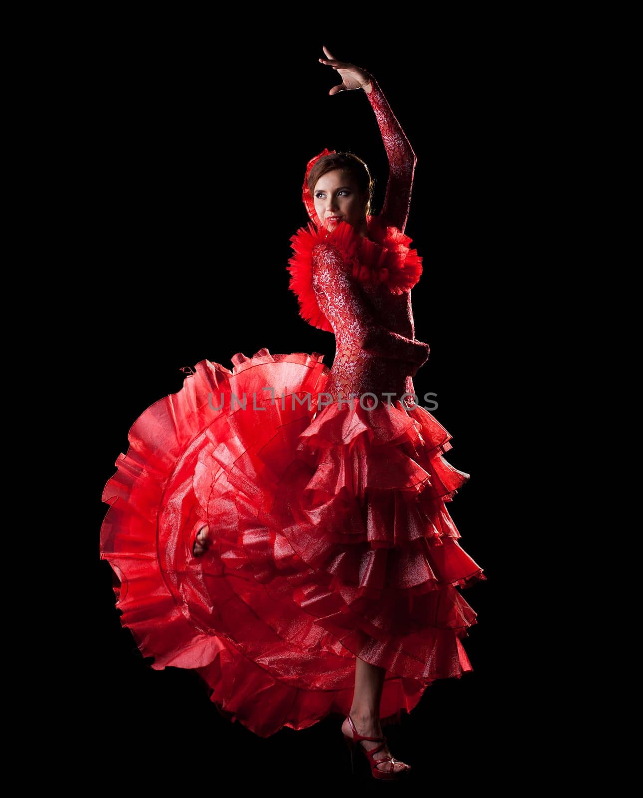 woman dance spain flamenco in red oriental costume in dark