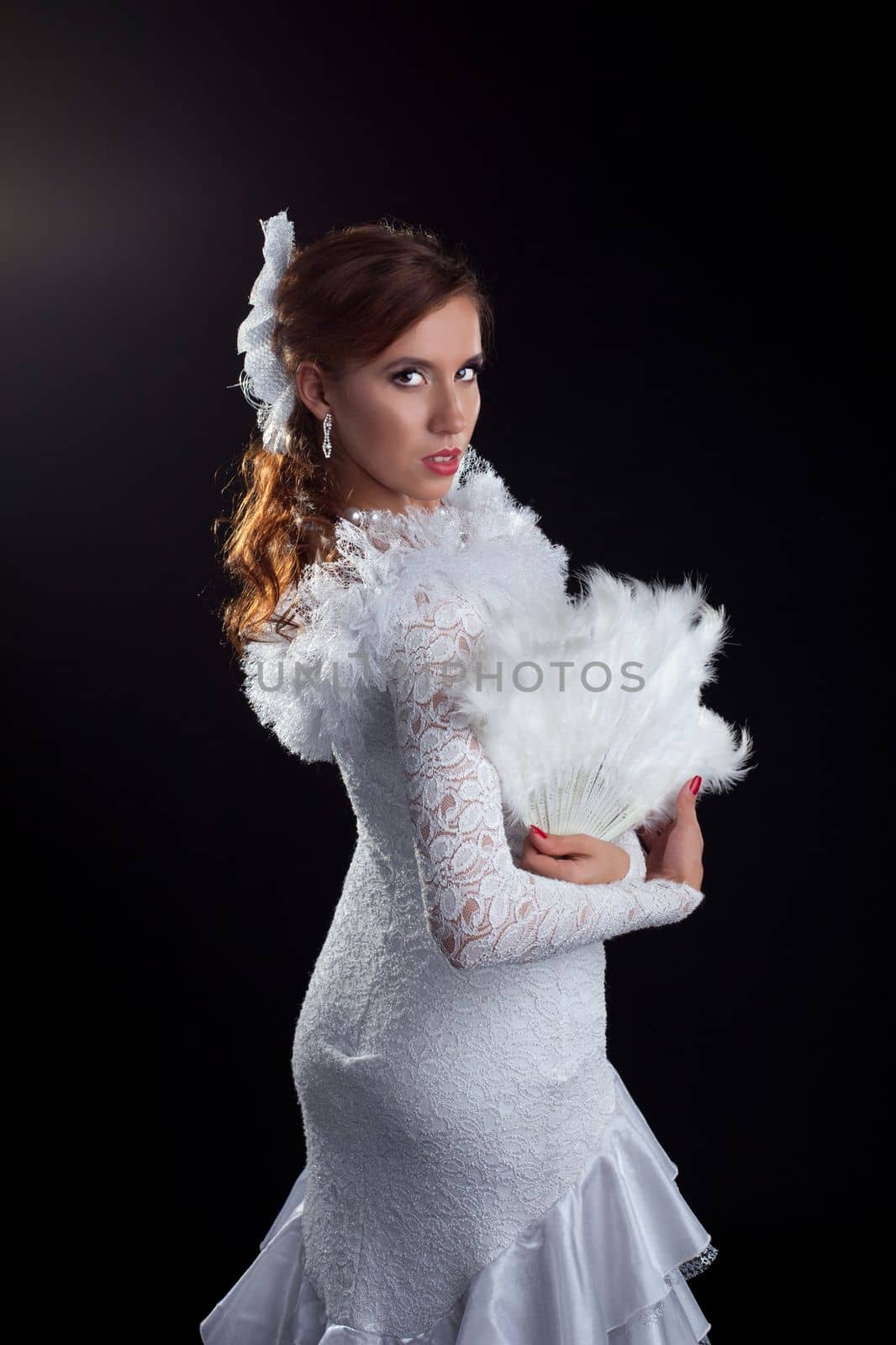 Studio portrait of dancer in white costume