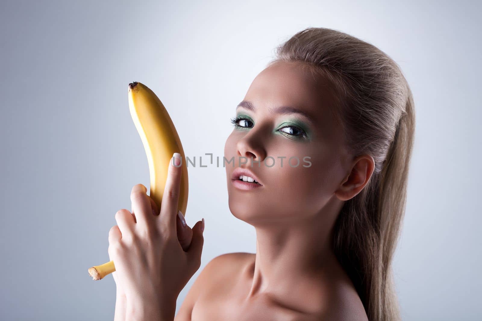 sexy girl take long banana like gun with desire