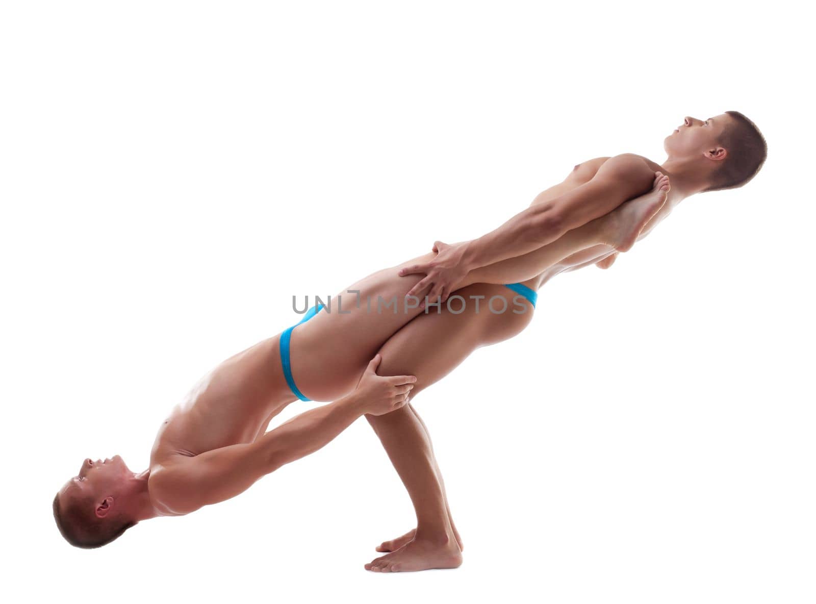 two young athletic man posing in balance isolated