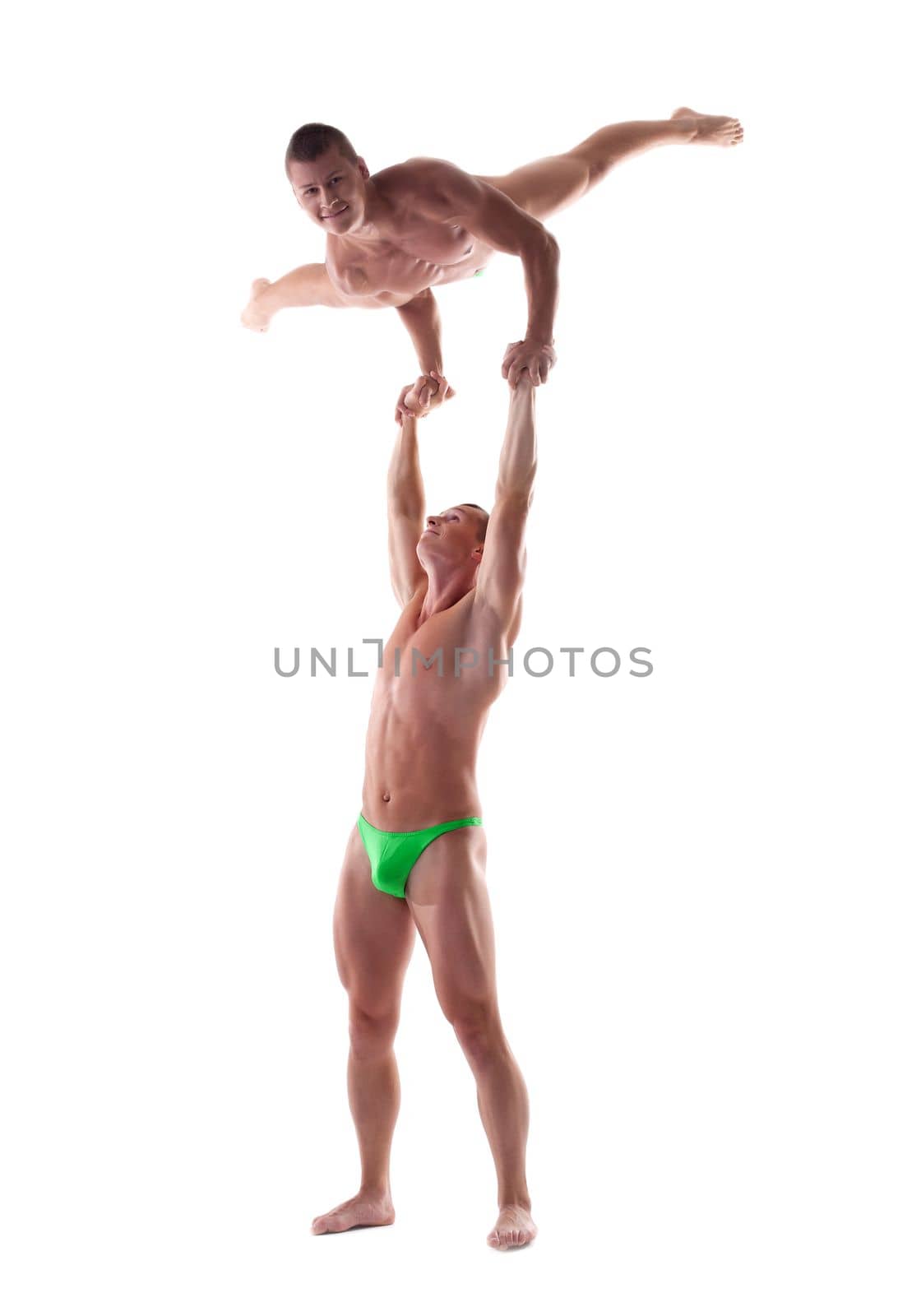 Two young strong man show gymnastic performance isolated