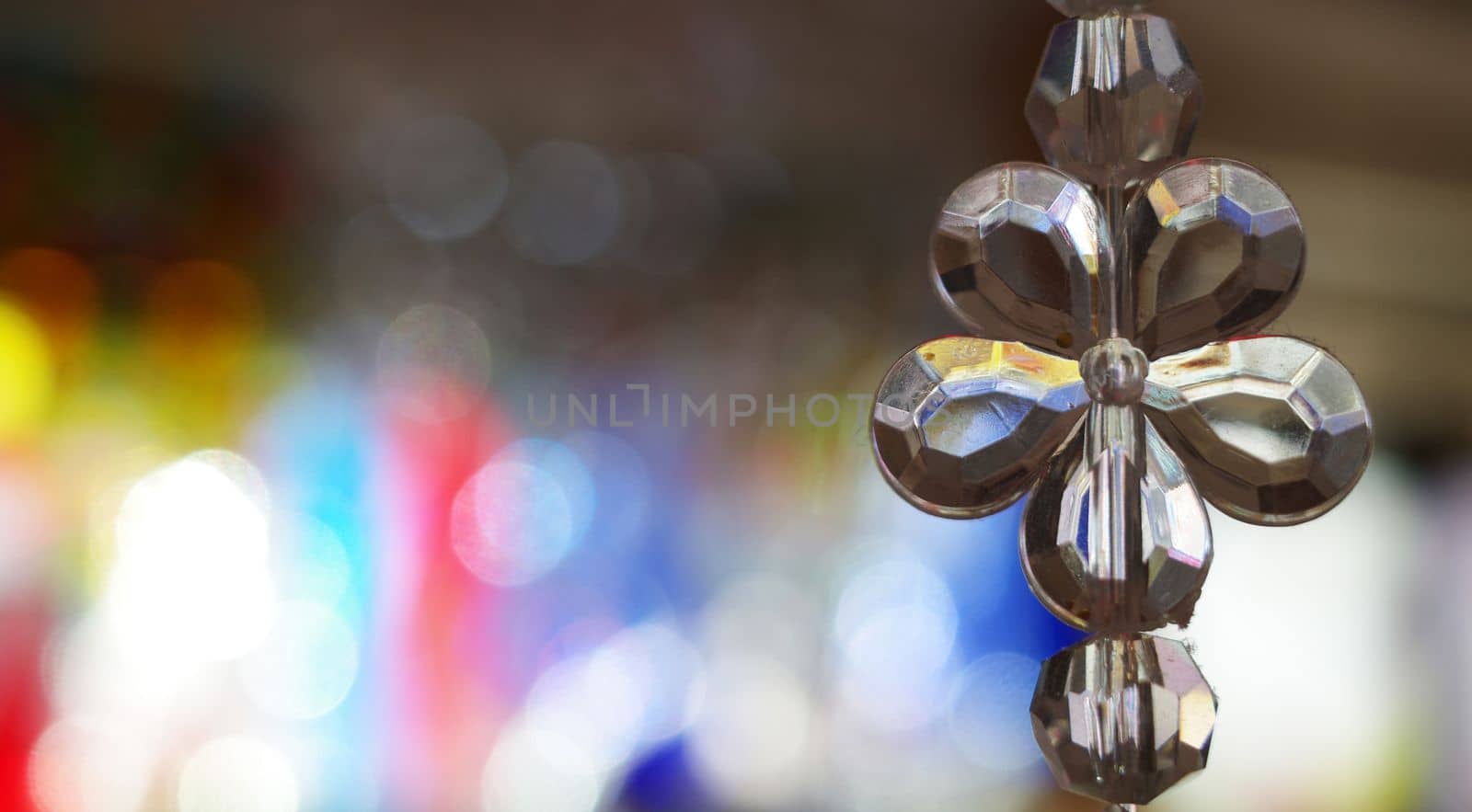 Hanging clear crystals on a thread. Flower shaped light catchers.