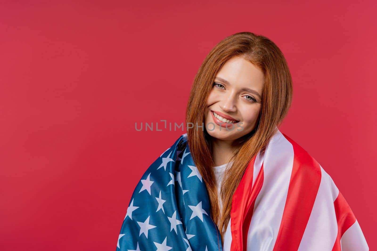 Smiling woman with national USA flag on pink background. American patriot, 4th of July - Independence day celebration, election, America, labor. US banner. by kristina_kokhanova