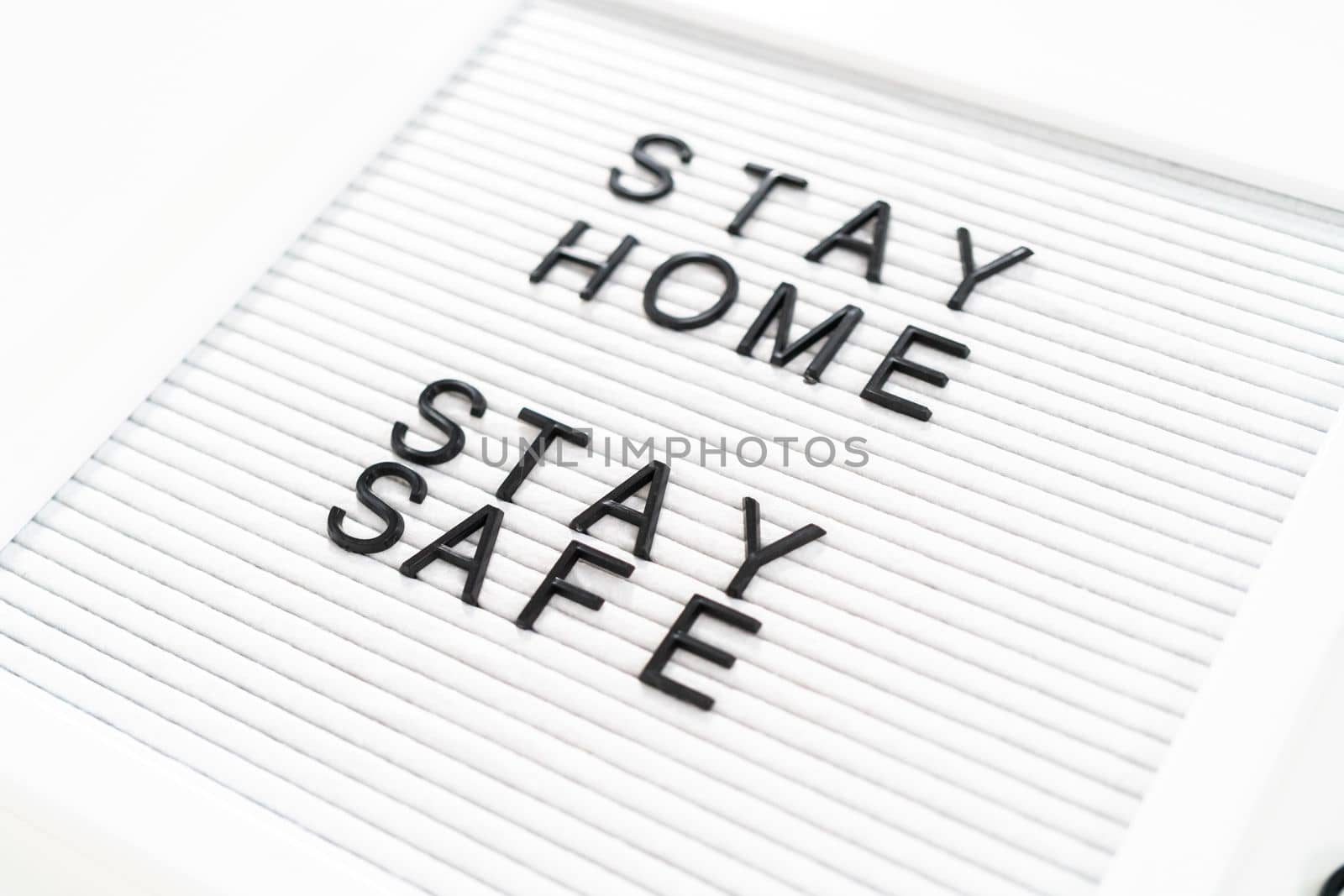 STAY HOME and STAY SAFE sign on message board.