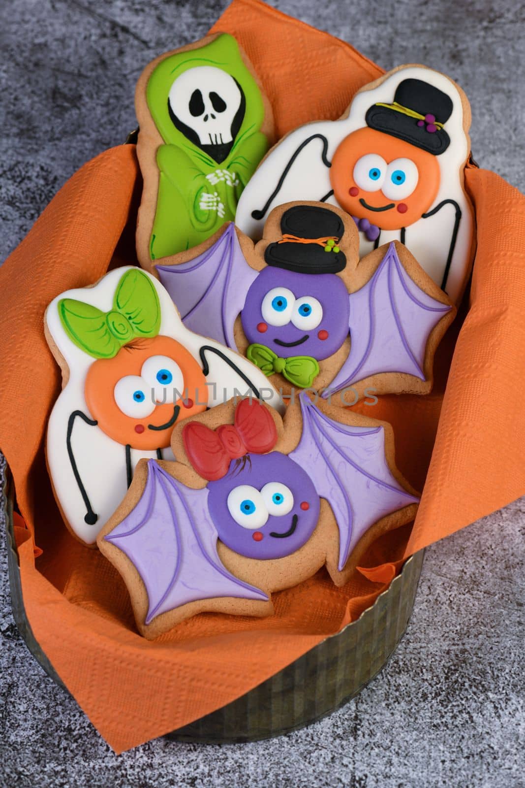 Happy Halloween with funny characters on gingerbread cookies; bat, ghost and spiders. Trick or treat. Traditional, party and holiday concept