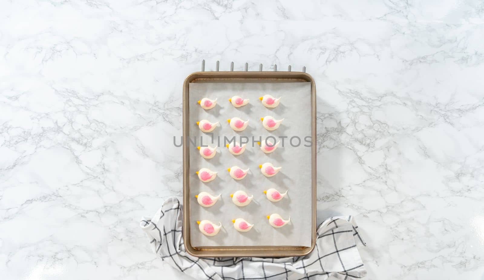 Freshly baked Easter meringue cookies in the shape of birds.