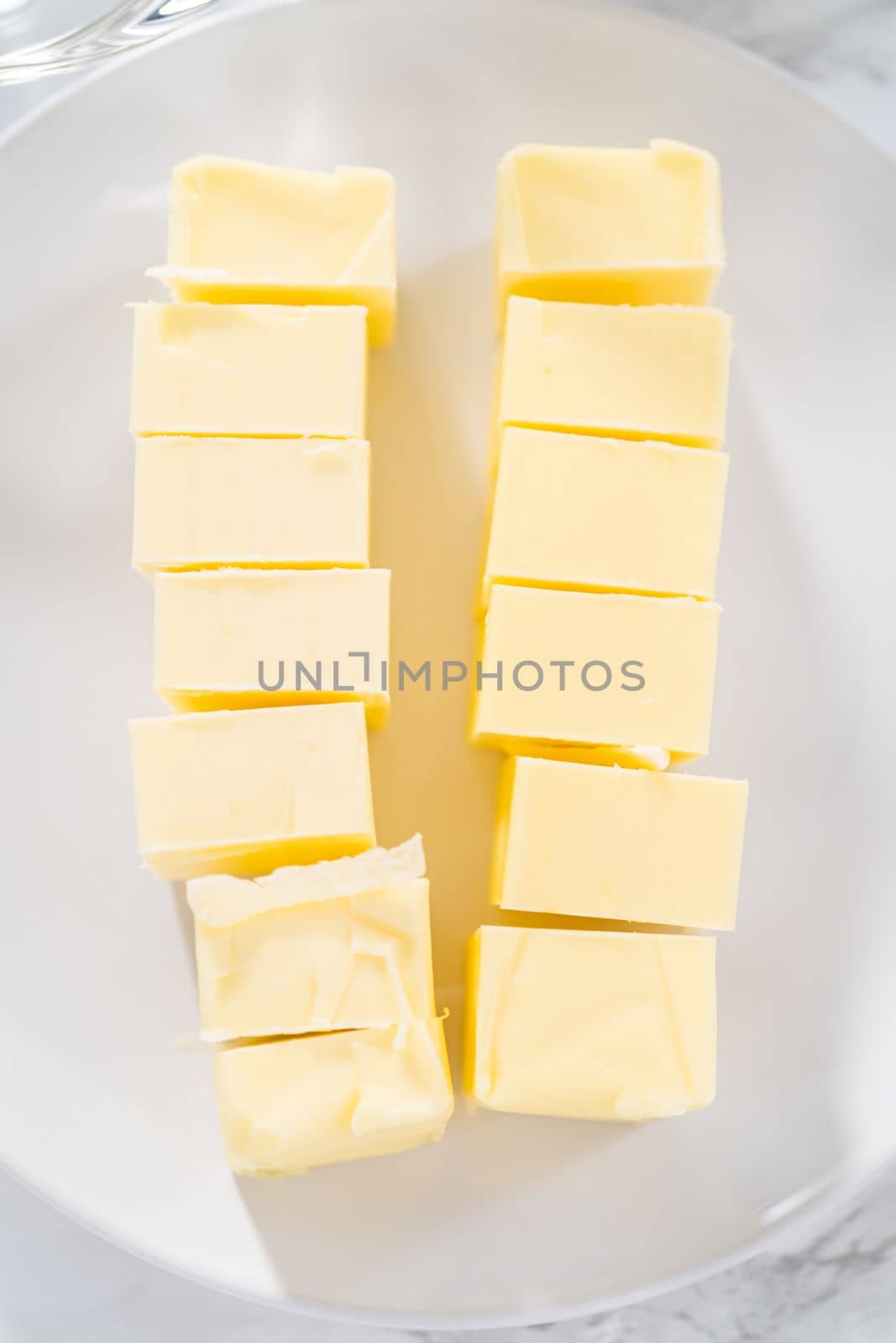 Ingredients in glass mixing bowls to prepare lemon bundt cake.