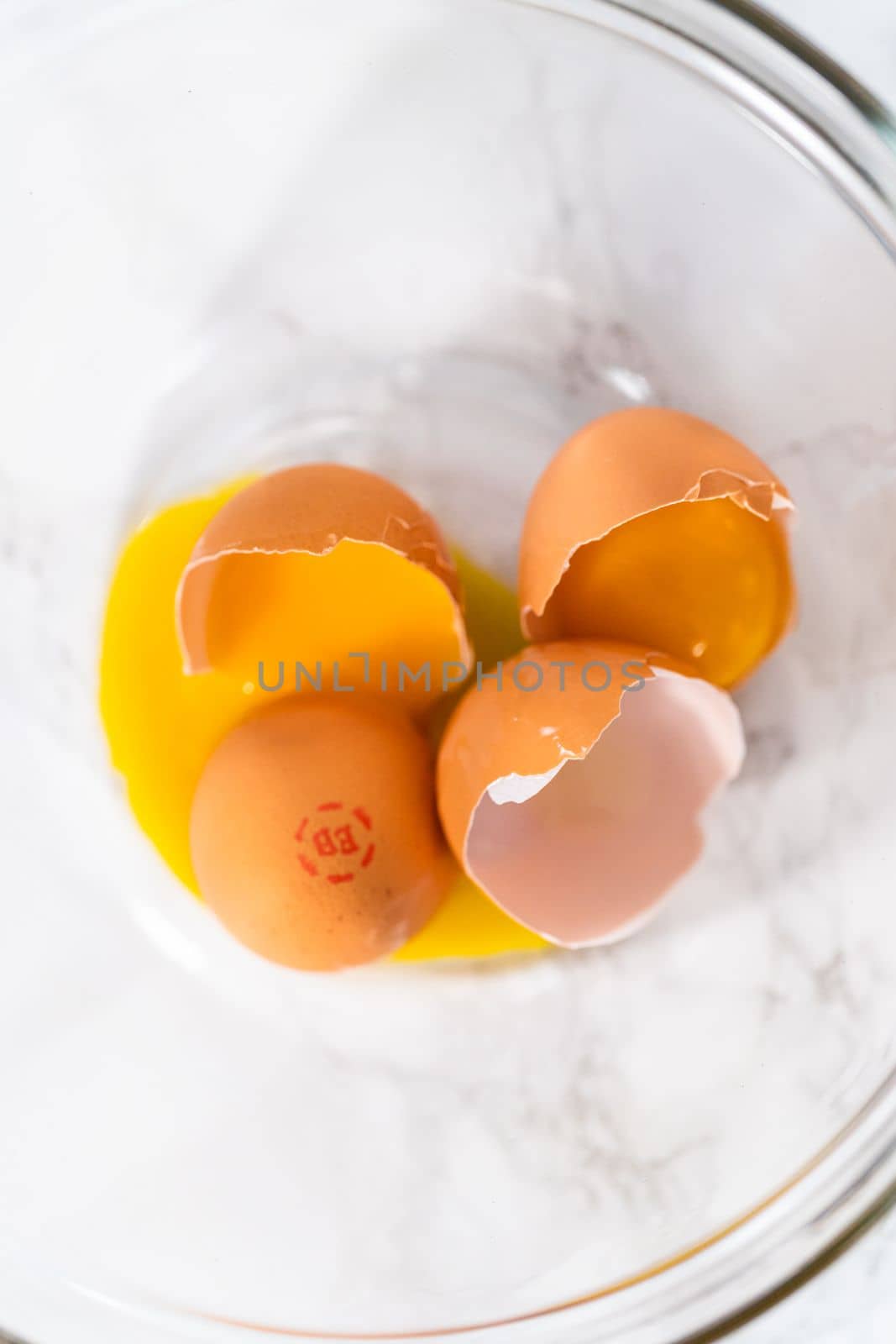 Separating egg whites and yolks to bake Easter meringue cookies.