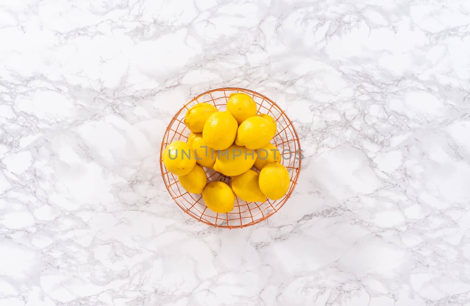 Flat lay. Ingredients in glass mixing bowls to prepare lemon bundt cake.