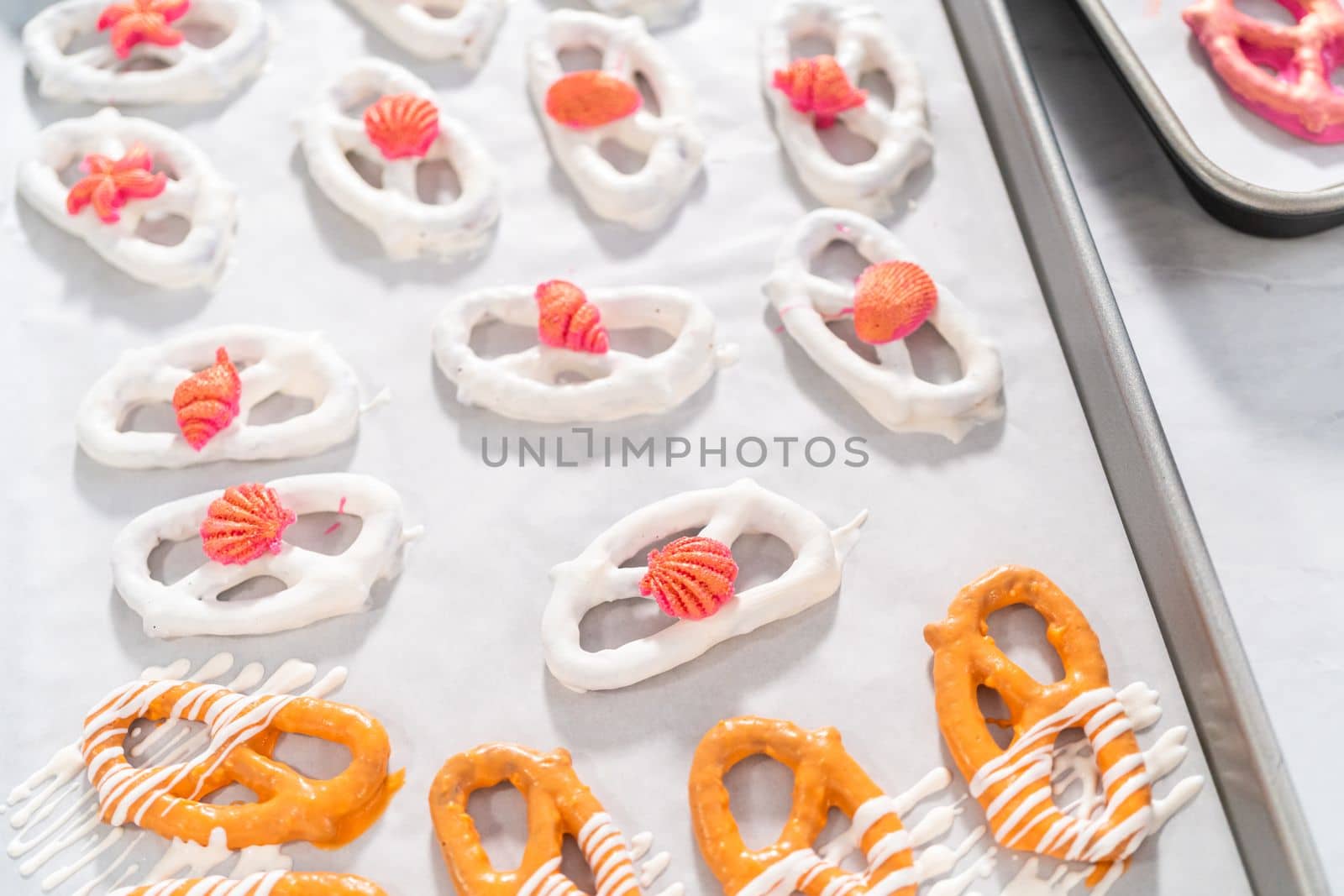 Gourmet chocolate-covered pretzel twists with seashell-shaped chocolates.