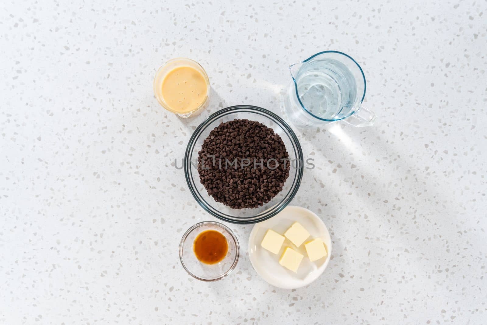 Flat lay. Measured ingredients in glass mixing bowls to make plain fudge.