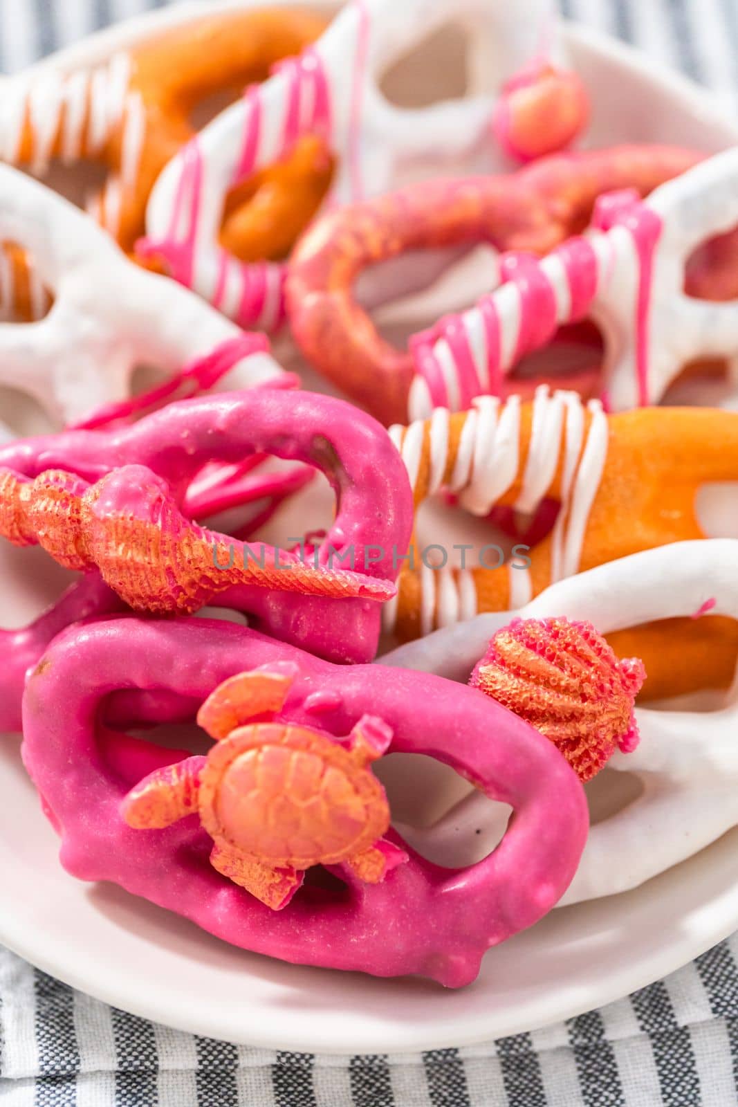 Gourmet chocolate-covered pretzel twists with seashell-shaped chocolates.
