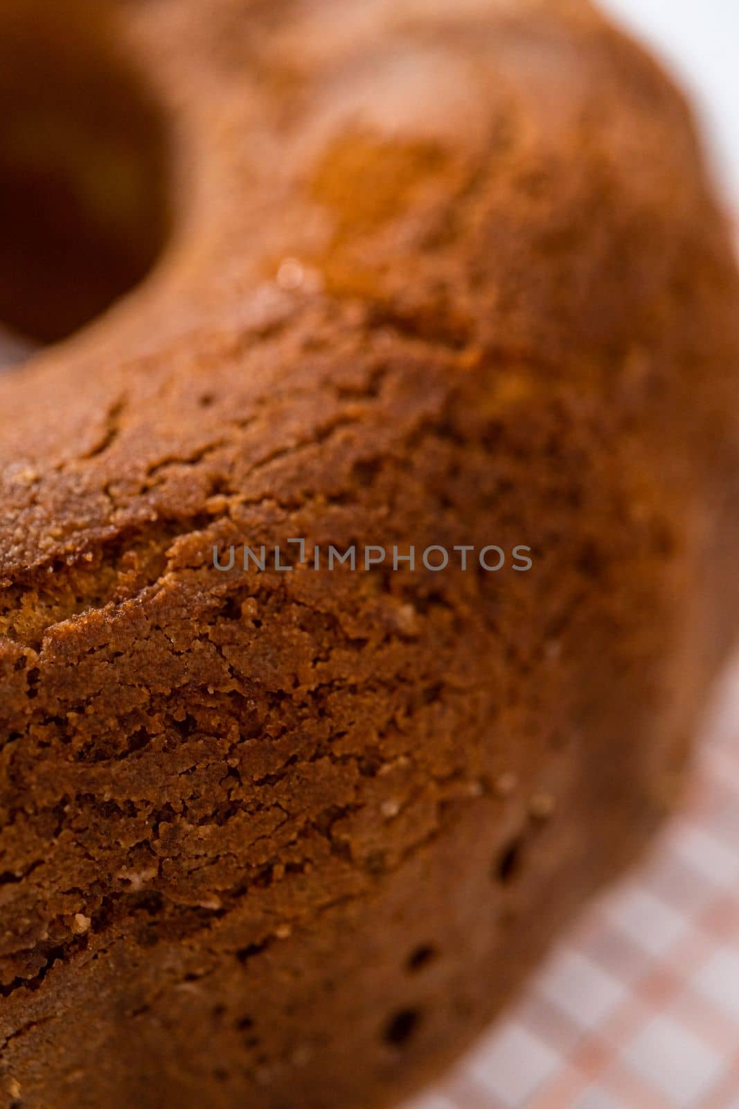 Cooling freshly baked eggnog bundt cake on a kitchen counter.