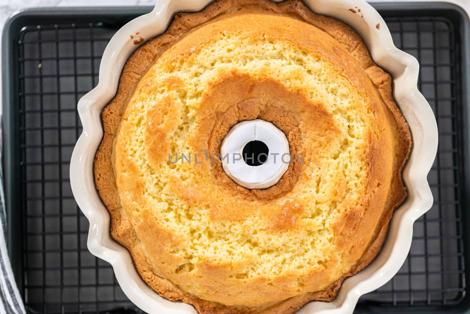 Freshly baked lemon bundt cake in a bundt cake pan.