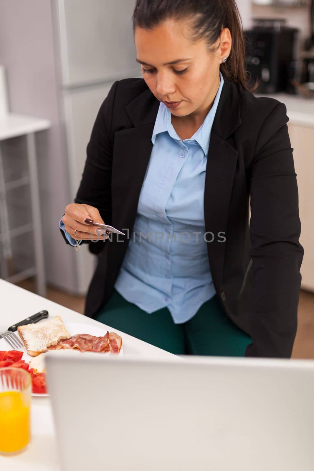 Woman paying the order online by DCStudio