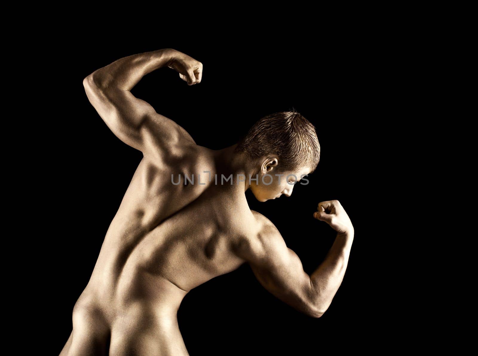 Nude athletic man posing in gold skin make-up by rivertime