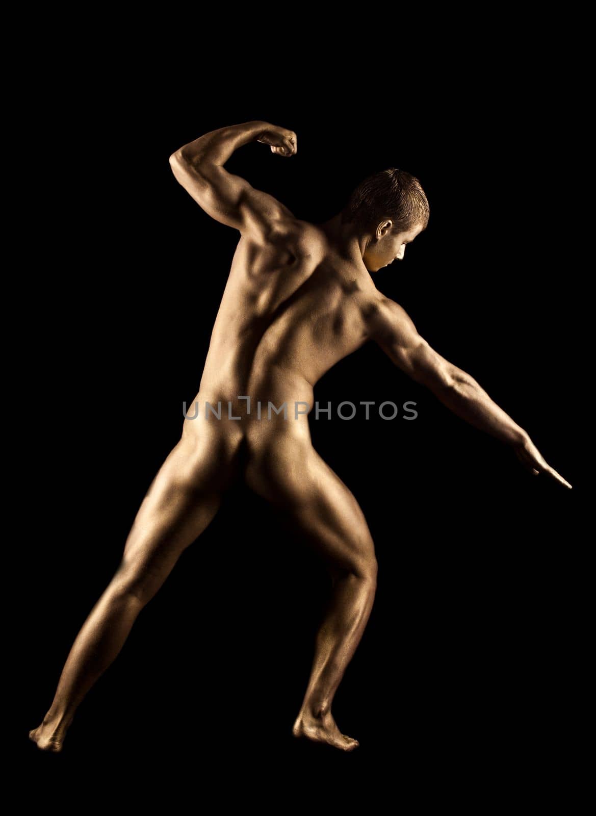 Naked strong man posing in gold skin by rivertime