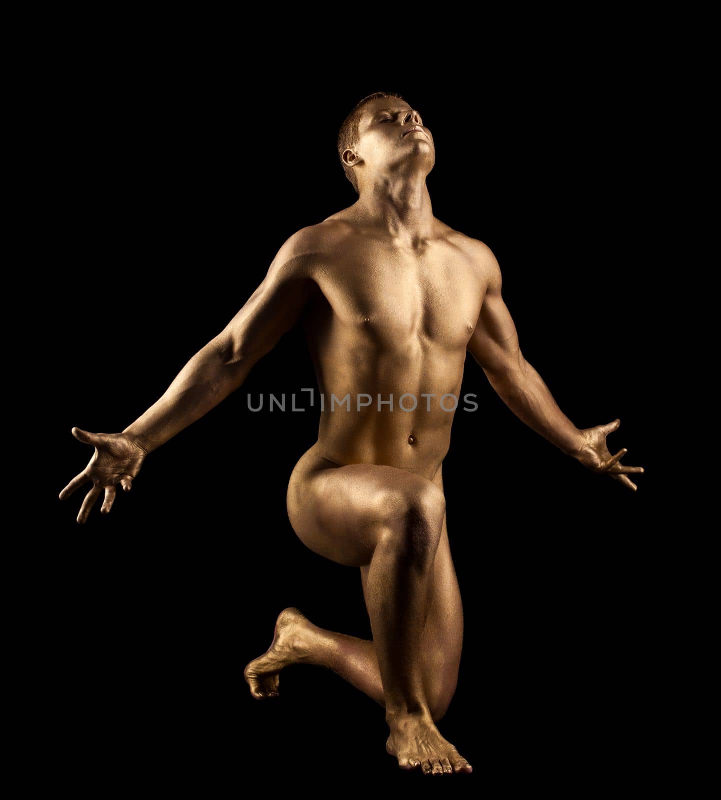Athletic naked man show perfect body with gold skin
