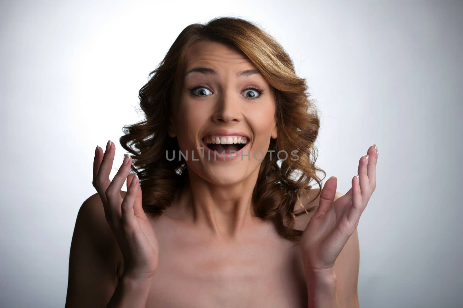 Beauty young woman point finger and smile about smart idea