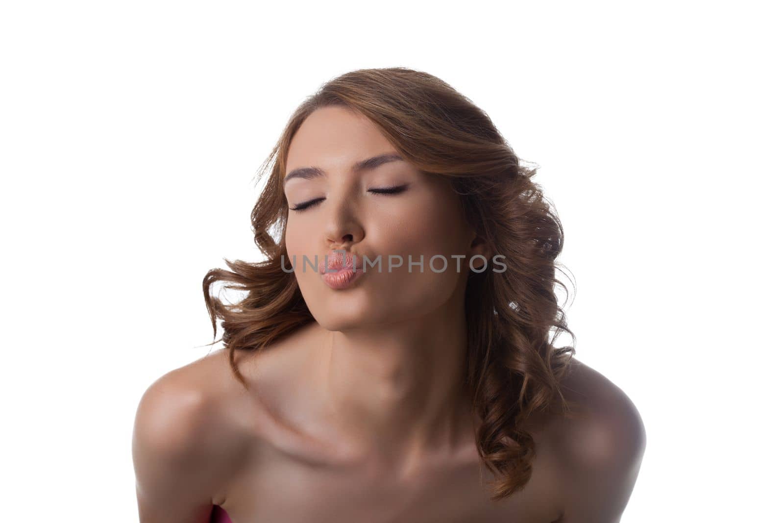 Sexy woman kissing with close eyes. Isolated on white
