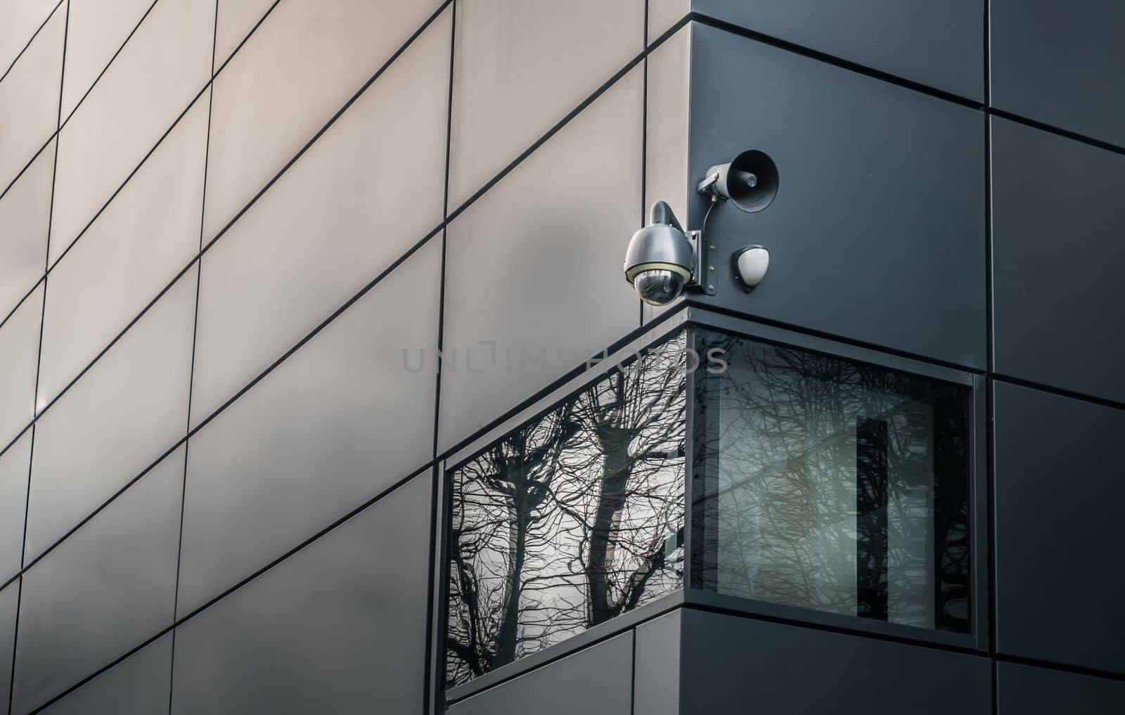 Security camera or CCTV is outsite on the wall of the modern building. Video equipment for safety system area control outdoor, The concept of Professional surveillance, Selective focus.