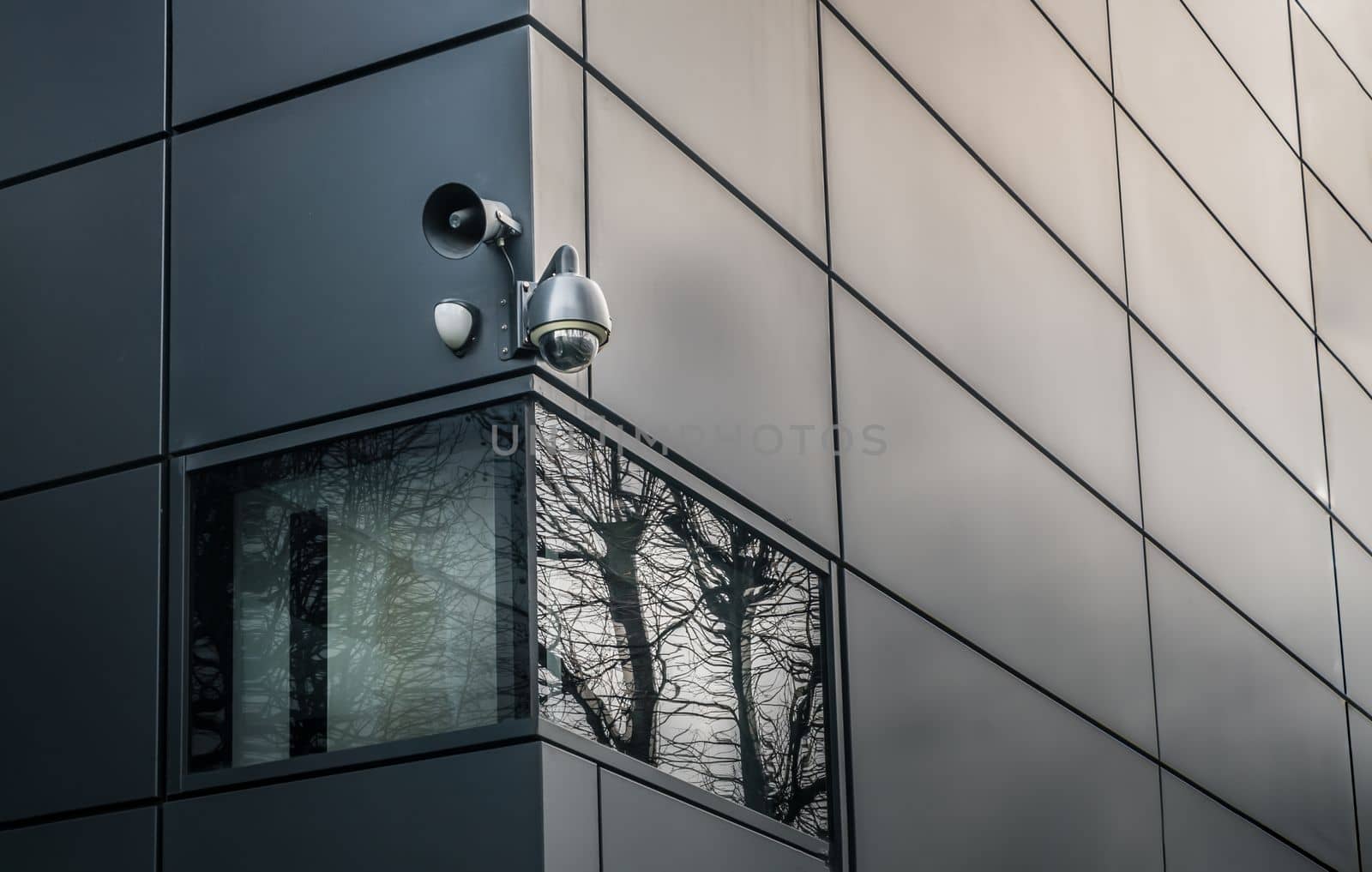 Security camera or CCTV is outsite on the wall of the modern building. Video equipment for safety system area control outdoor, The concept of Professional surveillance, Selective focus.