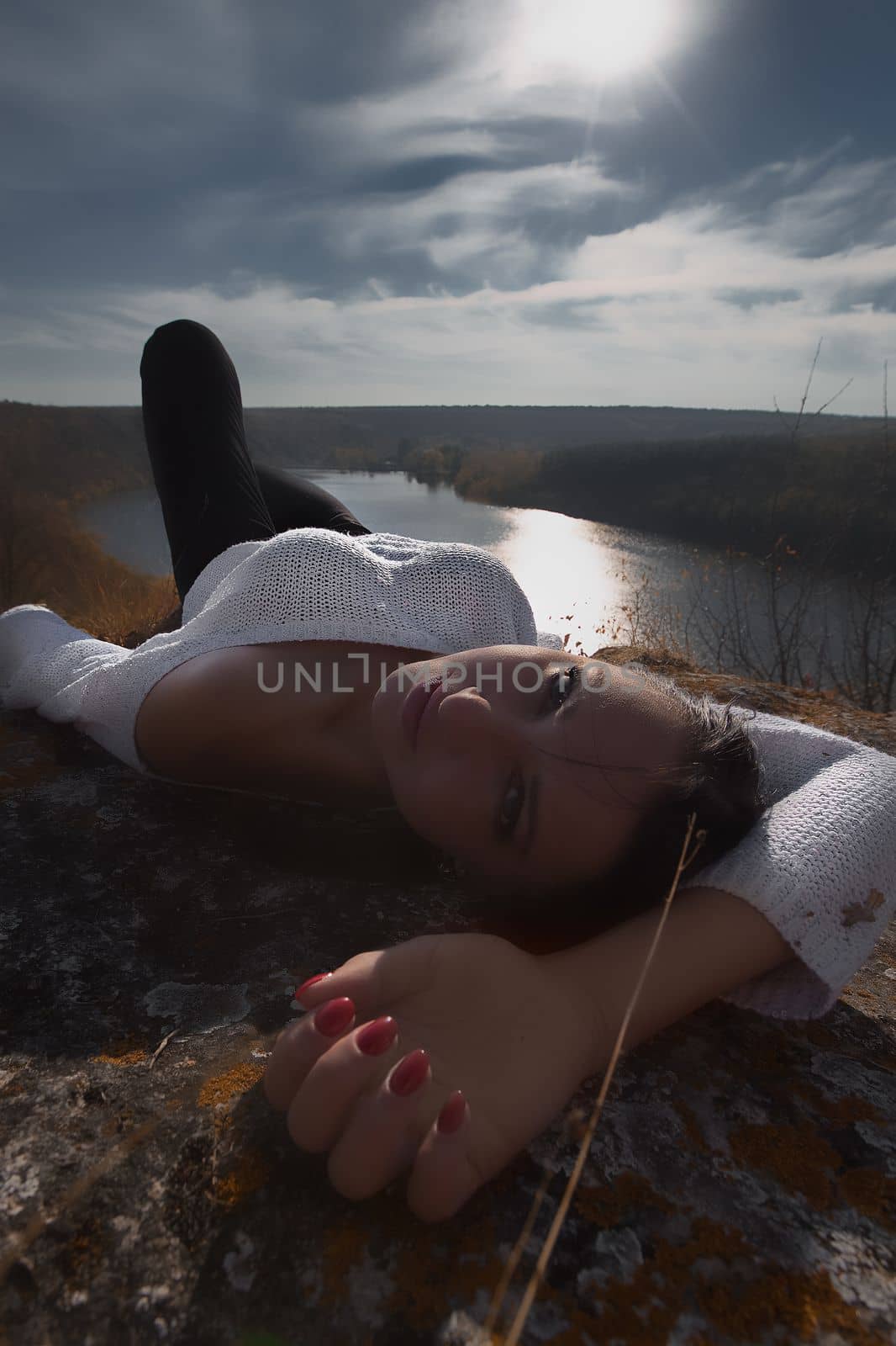 Fashion Gir. Beautiful fashionable glamor girl shows poses in modern clothes against the backdrop of beautiful scenery and flawless nature. creative photo. High quality photo
