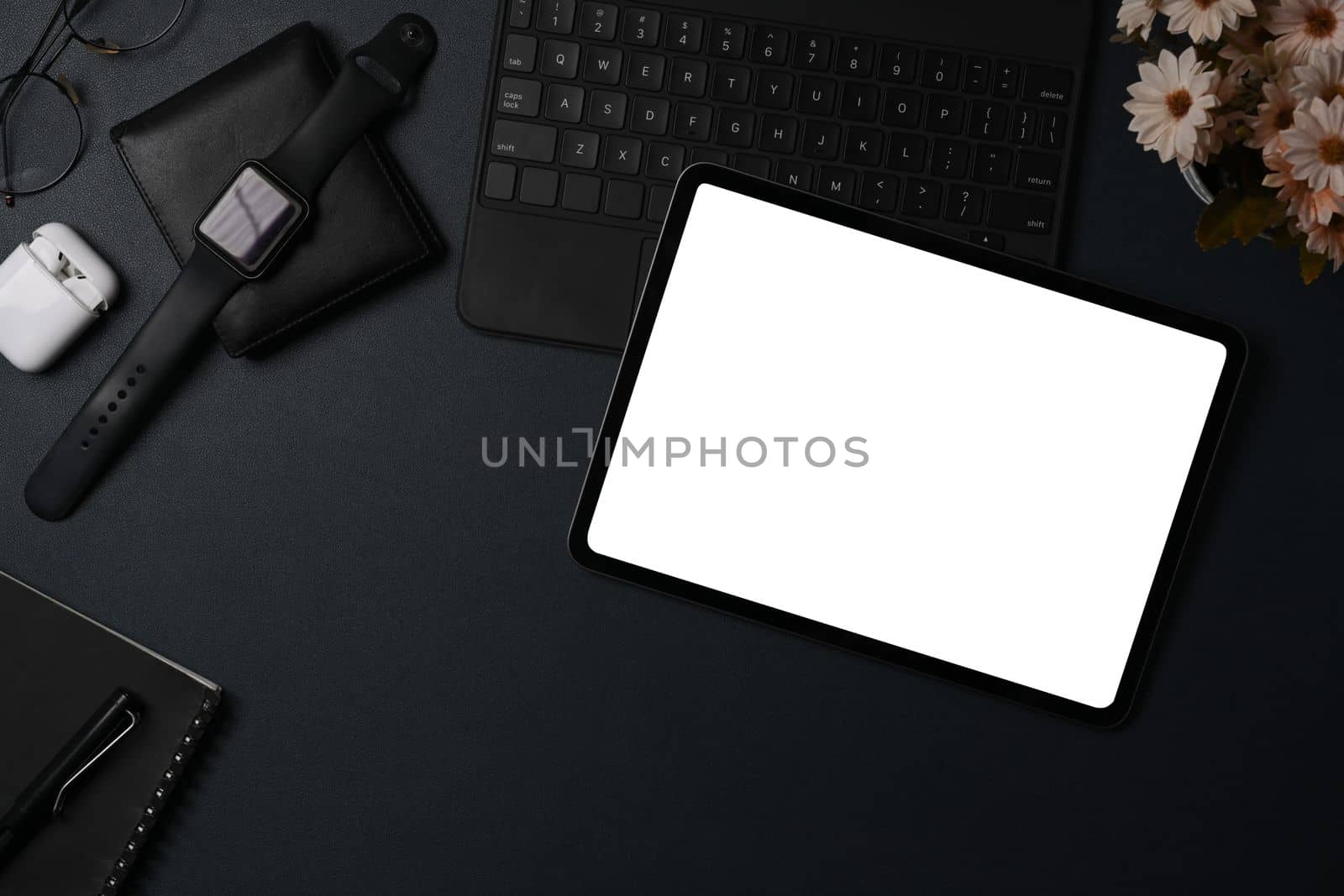 Above view digital tablet, smart watch and wallet on black leather. by prathanchorruangsak