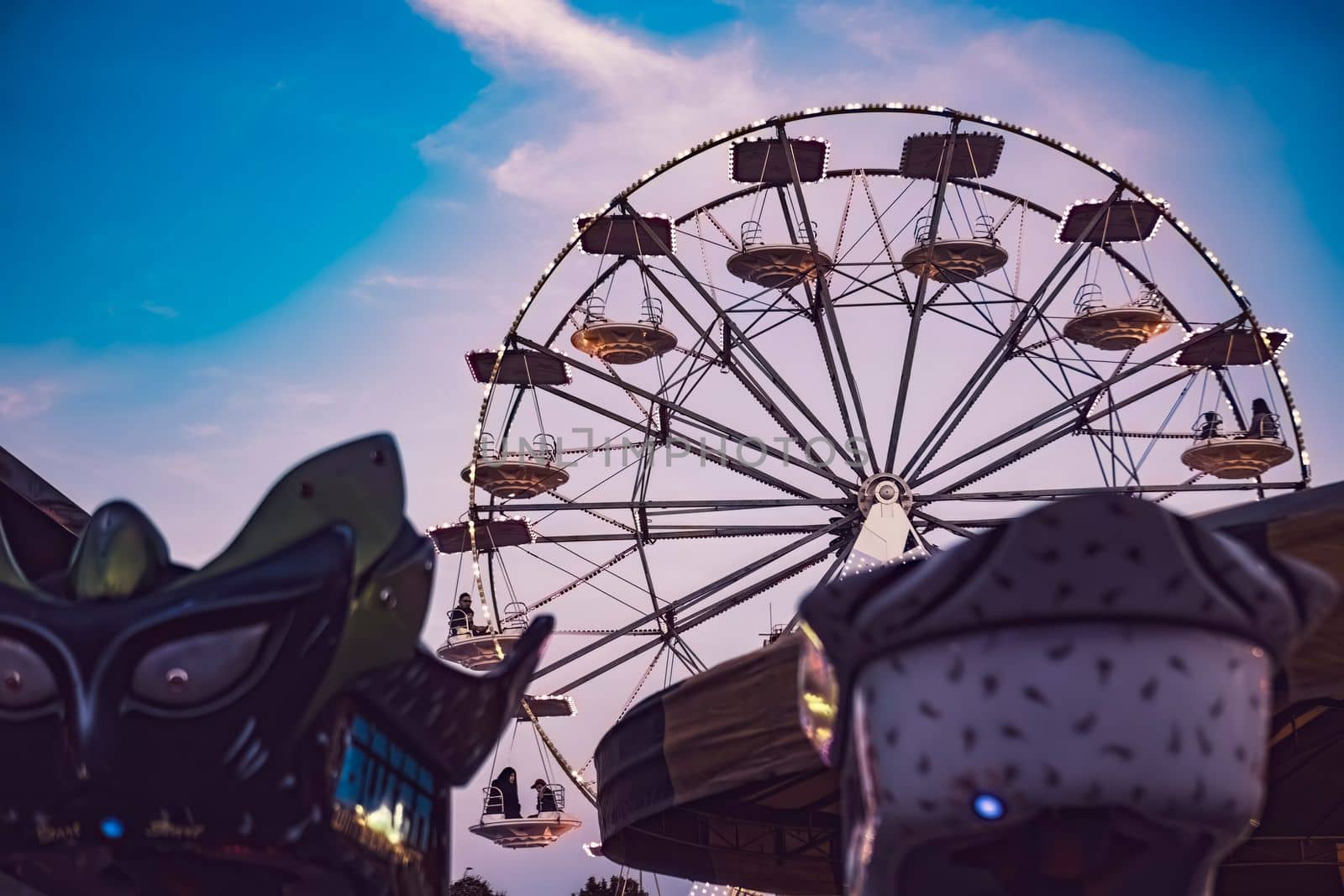 Rovigo, Italy 25 October 2022: Funfair ferris wheel at sunset