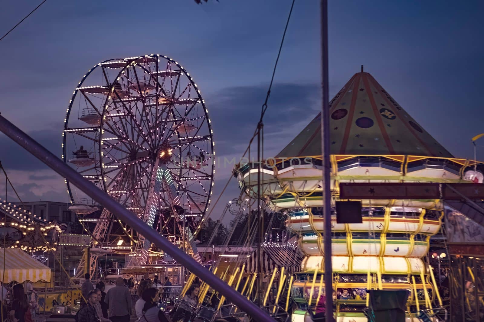 Rovigo, Italy 25 October 2022: Funfair ferris wheel at sunset