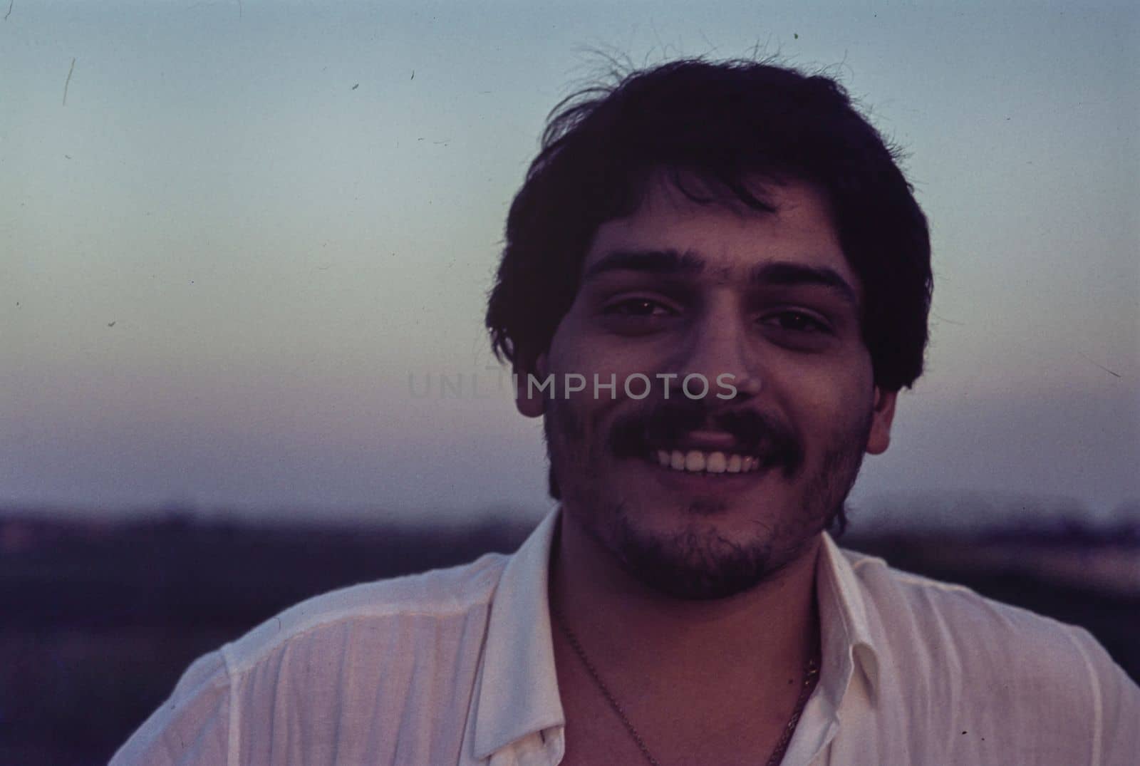 Rovigo, Italy october 1976: Man with mustache close up portrait in 70s