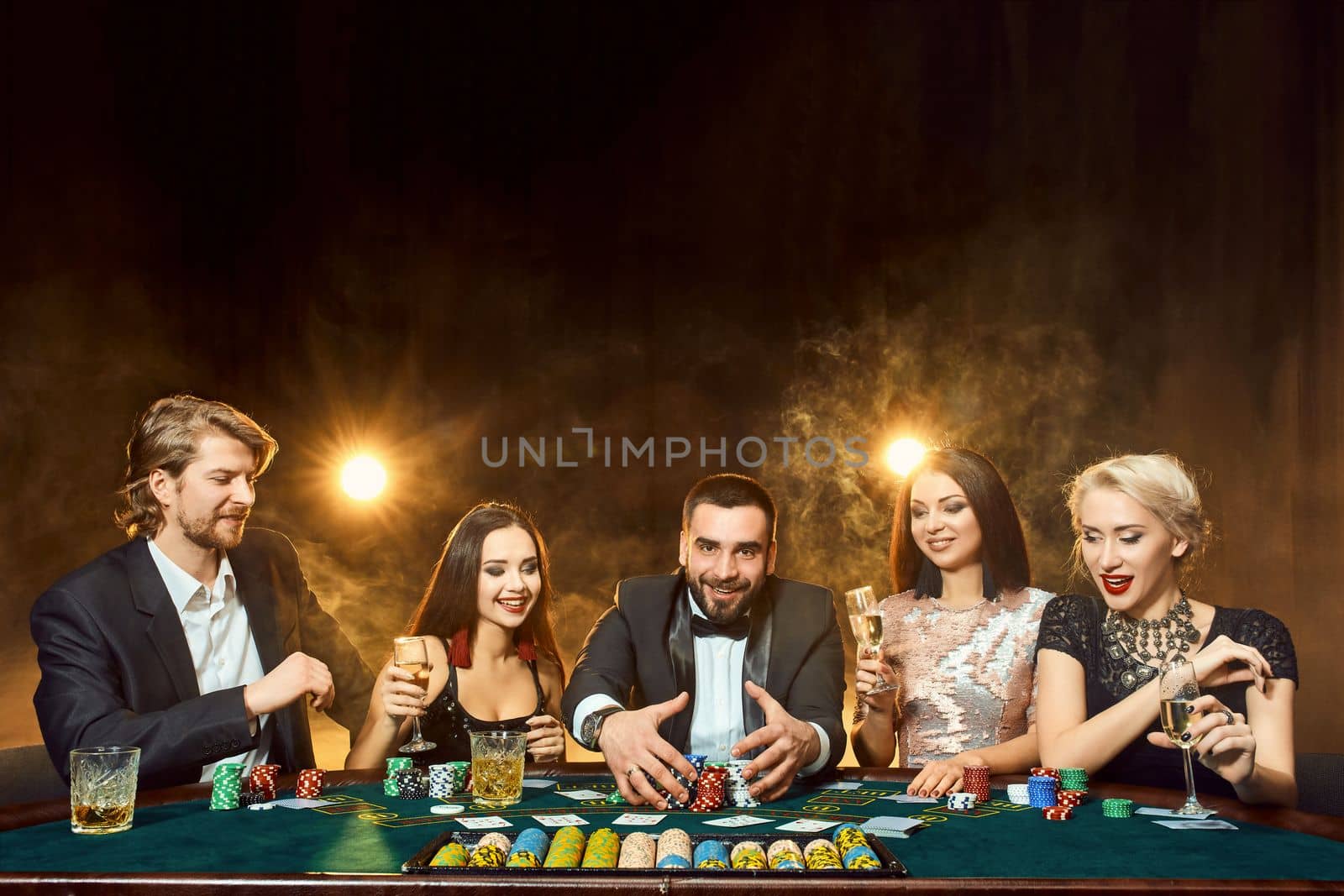 Poker players sitting around a table at a casino. Poker. Gambling. Casino