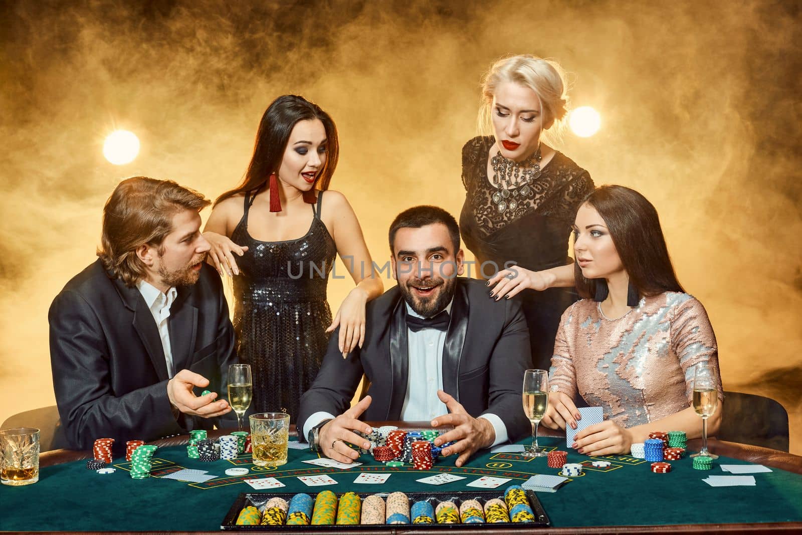 Poker players sitting around a table at a casino. Poker. Gambling. Casino